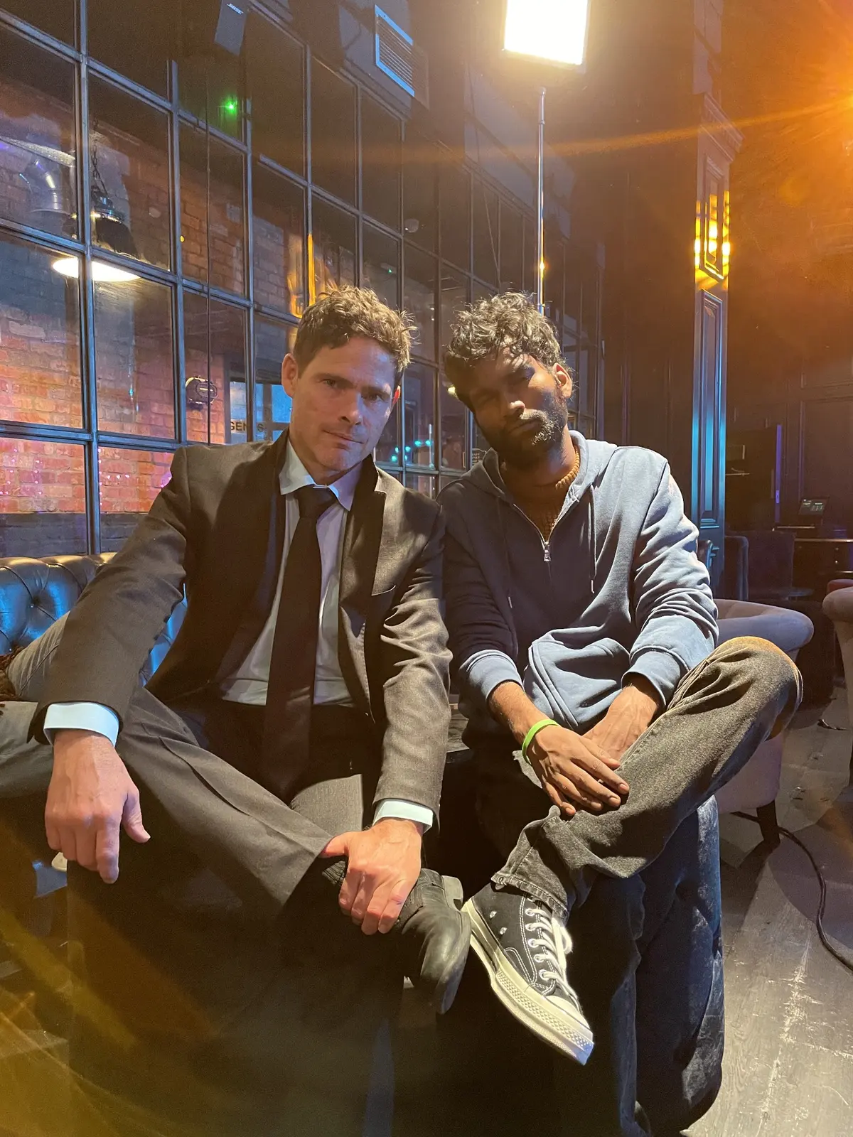 Alex Reece and Nikhil Vijay seated together behind the scenes on United Kacche