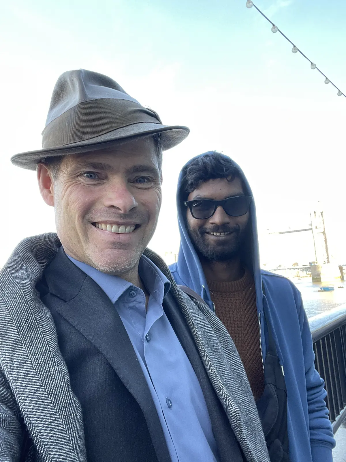 Alex Reece and Nikhil Vijay beside the Thames during filming of United Kacche